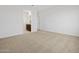 Bright bedroom with plush carpeting and ample space for relaxation or decor at 37126 W Prado St, Maricopa, AZ 85138
