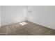 Neutral bedroom with beige carpet, white walls, and natural light at 37126 W Prado St, Maricopa, AZ 85138