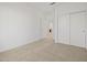 Simple bedroom with carpet, closet, and neutral paint for a blank canvas at 37126 W Prado St, Maricopa, AZ 85138