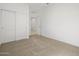Simple bedroom with carpet, closet, and neutral paint for a blank canvas at 37126 W Prado St, Maricopa, AZ 85138