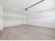 A spacious two car garage with new concrete flooring and bright lighting at 37126 W Prado St, Maricopa, AZ 85138