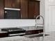 Close-up of the kitchen features, highlighting the countertops and appliances at 37126 W Prado St, Maricopa, AZ 85138
