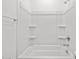 Shower tub combination featuring white tiling and chrome fixtures at 37126 W Prado St, Maricopa, AZ 85138