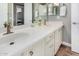 Bathroom features a double sink vanity with white cabinets and bronze hardware at 3751 E Zachary Dr, Phoenix, AZ 85050