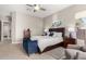 Comfortable bedroom with a plush bed, stylish blue decor, and ample natural light at 3751 E Zachary Dr, Phoenix, AZ 85050