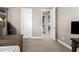 View of a bedroom featuring a bunk bed with steps, an open doorway, and neutral walls at 3751 E Zachary Dr, Phoenix, AZ 85050
