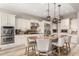 Bright kitchen features granite counters, stainless steel appliances and a large island with seating at 3751 E Zachary Dr, Phoenix, AZ 85050