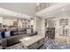 Open-concept living space featuring a cozy seating arrangement and seamless transition to the modern kitchen at 3751 E Zachary Dr, Phoenix, AZ 85050