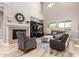 Bright living room with fireplace, entertainment center, and comfortable seating, perfect for relaxing or entertaining at 3751 E Zachary Dr, Phoenix, AZ 85050