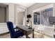 Cozy home office featuring a wooden desk, comfortable chair, and a view to the outdoor patio at 3751 E Zachary Dr, Phoenix, AZ 85050