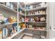 Well-stocked pantry with ample shelving, offering plenty of storage space for food and household items at 3751 E Zachary Dr, Phoenix, AZ 85050