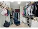 Spacious walk-in closet with hanging rods, shelves, and organized storage solutions at 3751 E Zachary Dr, Phoenix, AZ 85050