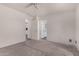 A cozy bedroom with a ceiling fan, neutral paint and carpet at 42311 W Bunker Dr, Maricopa, AZ 85138