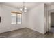 Picture of a bright dining room featuring laminate floors and neutral paint at 42311 W Bunker Dr, Maricopa, AZ 85138