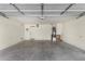 This garage provides ample space for parking with a door to the side of the house at 42311 W Bunker Dr, Maricopa, AZ 85138