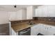 Well-lit kitchen featuring stainless steel appliances and granite countertops at 42311 W Bunker Dr, Maricopa, AZ 85138