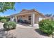 Inviting covered patio area with comfortable seating, offering a perfect spot for outdoor dining and relaxation at 426 N Santiago Trl, Casa Grande, AZ 85194