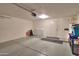 This is an image of a garage with painted floors, storage, and an insulated door at 426 N Santiago Trl, Casa Grande, AZ 85194