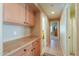 Hallway with built in cabinets and access to other rooms in the home at 426 N Santiago Trl, Casa Grande, AZ 85194