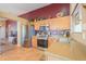 Well-equipped kitchen featuring stainless steel appliances, ample cabinet space and decorative tile floors at 426 N Santiago Trl, Casa Grande, AZ 85194