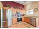 Well-equipped kitchen with stainless steel appliances and ample counter space at 426 N Santiago Trl, Casa Grande, AZ 85194