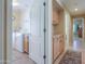 View of the laundry room with a washer and dryer, a utility sink, and access to hallway at 426 N Santiago Trl, Casa Grande, AZ 85194