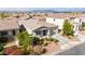 Well-maintained home with mature landscaping, a long driveway, and close proximity to neighboring houses at 460 W Glacier Bay Dr, San Tan Valley, AZ 85140