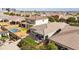 Sprawling backyard featuring a swimming pool, a patio with outdoor seating, and artificial turf at 460 W Glacier Bay Dr, San Tan Valley, AZ 85140