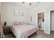 Cozy bedroom featuring a comfortable bed, ensuite bathroom, and a stylish design at 460 W Glacier Bay Dr, San Tan Valley, AZ 85140