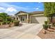 Well-maintained single-Gathering home with a two-car garage, desert landscaping, and a concrete driveway at 460 W Glacier Bay Dr, San Tan Valley, AZ 85140