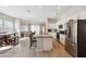 Open concept kitchen with stainless steel appliances, a large island, and sightlines to living area at 460 W Glacier Bay Dr, San Tan Valley, AZ 85140