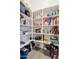 Well-stocked walk-in pantry with multiple shelves and ample storage space for food and kitchen essentials at 460 W Glacier Bay Dr, San Tan Valley, AZ 85140