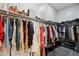 Spacious walk-in closet with organized shelving and ample hanging space for clothing and accessories at 460 W Glacier Bay Dr, San Tan Valley, AZ 85140