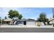 Charming single-story home features a gray exterior, well-manicured yard, and a two-car garage at 5007 N 71St Dr, Glendale, AZ 85303