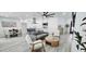 Open-concept living room featuring modern decor and seamless flow to the dining area and updated kitchen at 5007 N 71St Dr, Glendale, AZ 85303