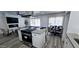 Spacious living area featuring an open kitchen, fireplace, a ceiling fan, and modern decor at 5007 N 71St Dr, Glendale, AZ 85303