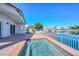 Exterior backyard featuring a built-in spa, covered patio and canal views at 5226 W Pontiac Dr, Glendale, AZ 85308