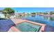 Exterior backyard featuring a built-in spa and serene canal views at 5226 W Pontiac Dr, Glendale, AZ 85308