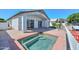 Backyard featuring a built-in spa and views of the covered patio and adjacent canal at 5226 W Pontiac Dr, Glendale, AZ 85308