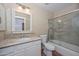 Bathroom features a vanity with granite countertops, a shower with granite tile, and a toilet at 5226 W Pontiac Dr, Glendale, AZ 85308