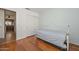 Bedroom features wood floors and a day bed with a white frame at 5226 W Pontiac Dr, Glendale, AZ 85308