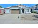 Charming single-story home featuring a well-manicured front yard, two-car garage and desert landscaping at 5226 W Pontiac Dr, Glendale, AZ 85308