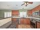 Kitchen with wood cabinets, granite counters, stainless appliances, tile backsplash at 5226 W Pontiac Dr, Glendale, AZ 85308