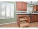 Kitchen detail showing custom pull out drawer features and granite countertops at 5226 W Pontiac Dr, Glendale, AZ 85308
