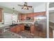 Updated kitchen with stainless steel appliances, granite countertops, and tile backsplash at 5226 W Pontiac Dr, Glendale, AZ 85308