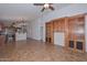 Living room with beautiful tile floors, open floor plan, and access to kitchen at 5226 W Pontiac Dr, Glendale, AZ 85308