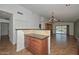 View from kitchen shows open plan with tile floors and access to backyard patio at 5226 W Pontiac Dr, Glendale, AZ 85308
