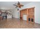 Open living room showing built-in shelves and a view into the kitchen at 5226 W Pontiac Dr, Glendale, AZ 85308
