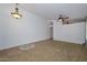 View of the spacious living room with a decorative tile entry and an open floor plan at 5226 W Pontiac Dr, Glendale, AZ 85308
