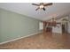 View of living room featuring bright light, tile floors and access to kitchen at 5226 W Pontiac Dr, Glendale, AZ 85308